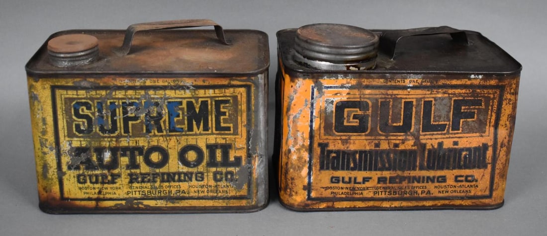 Supreme Motor Oil & Gulf Trans Lube One Gallon Squatty Cans: rated 6, the one gallon squatty cans have wear and scratches, both are empty.
