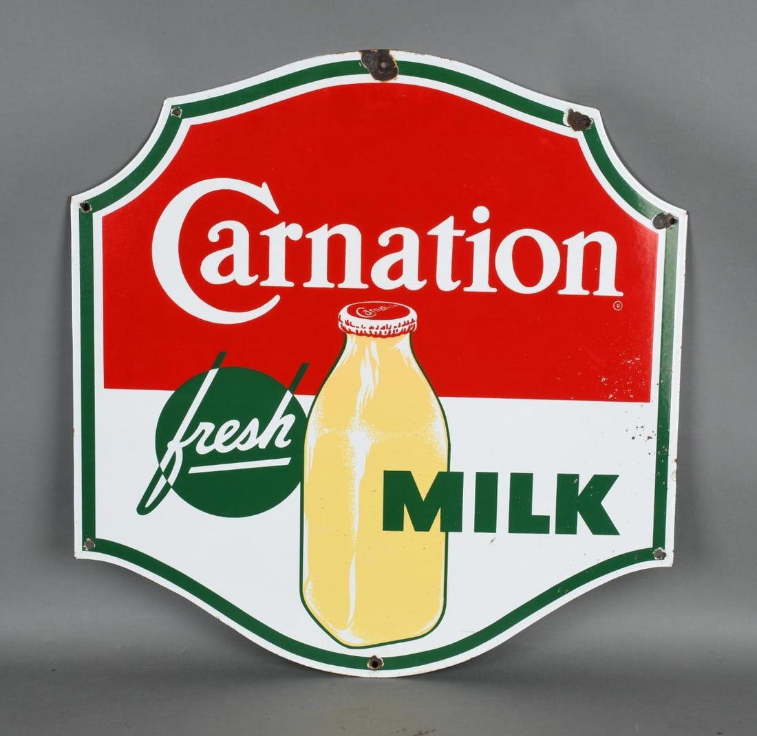 Carnation Fresh Milk Porcelain Sign (TAC): rated 8.5, 23"x22", the SSP diecut sign has excellent color and gloss, has welding spatter at the right-hand edge, has small chips at mounting holes. TAC #044667