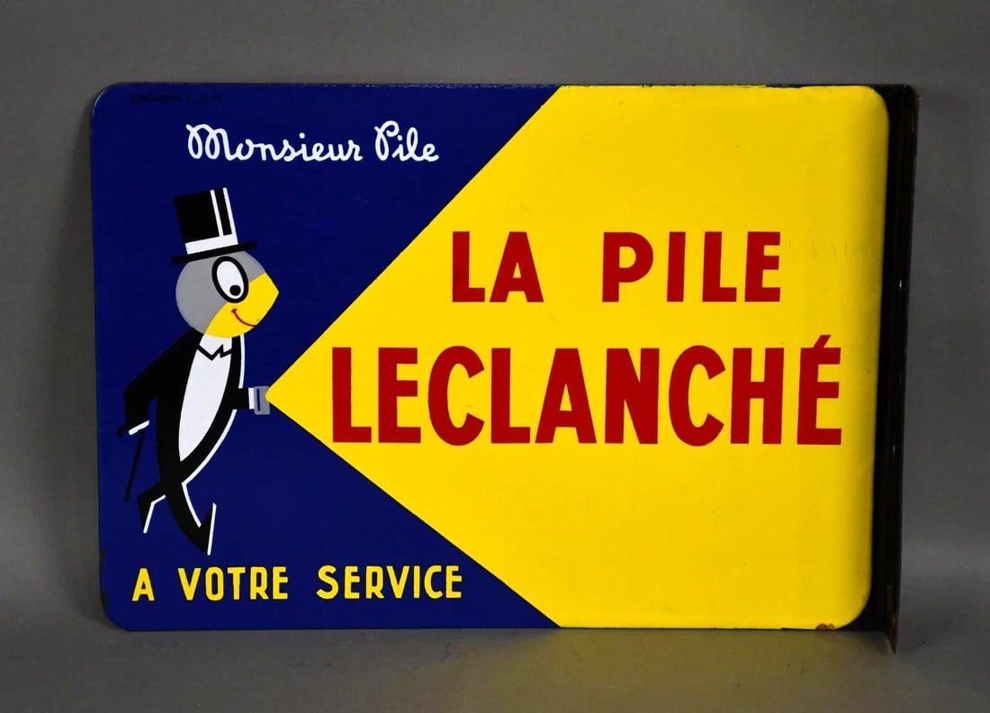 Monsieur Pile La Pile Leclanche (batteries) w/Logo Porcelain Flange Sign (TAC): rated 9, 15"x21", the porcelain flange sign has excellent color and gloss, nice. TAC #043956