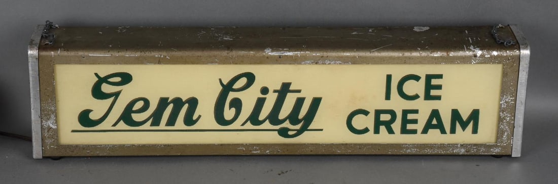 Gen City Ice Cream Lighted Sign: rated 8, 7"x27"x4", the front rippled plastic lens is in good condition ,the metal light box has wear and scratches, lights up.