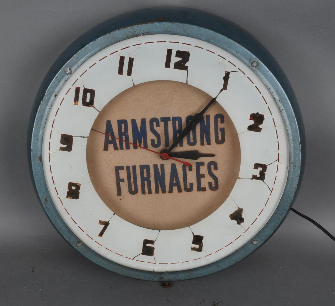 Armstrong Furnaces Lighted Clock: rated 5.5, 16"D., the light clock the face is soiled, outer lens has paint loss and crazing, clock works and lights up.