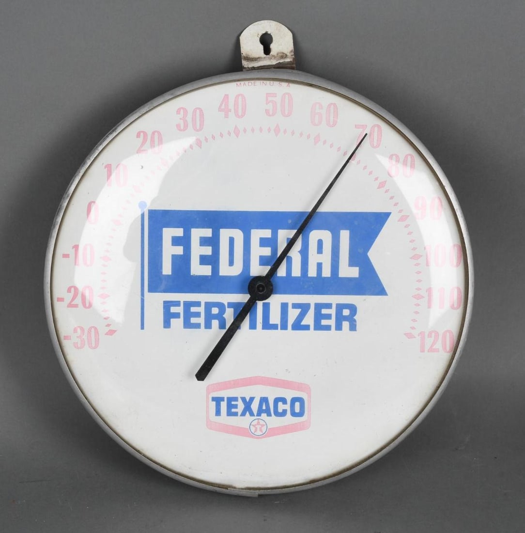 Texaco Federal Fertilize Round Thermometer: rated 7, 12"D. the thermometer is faded.