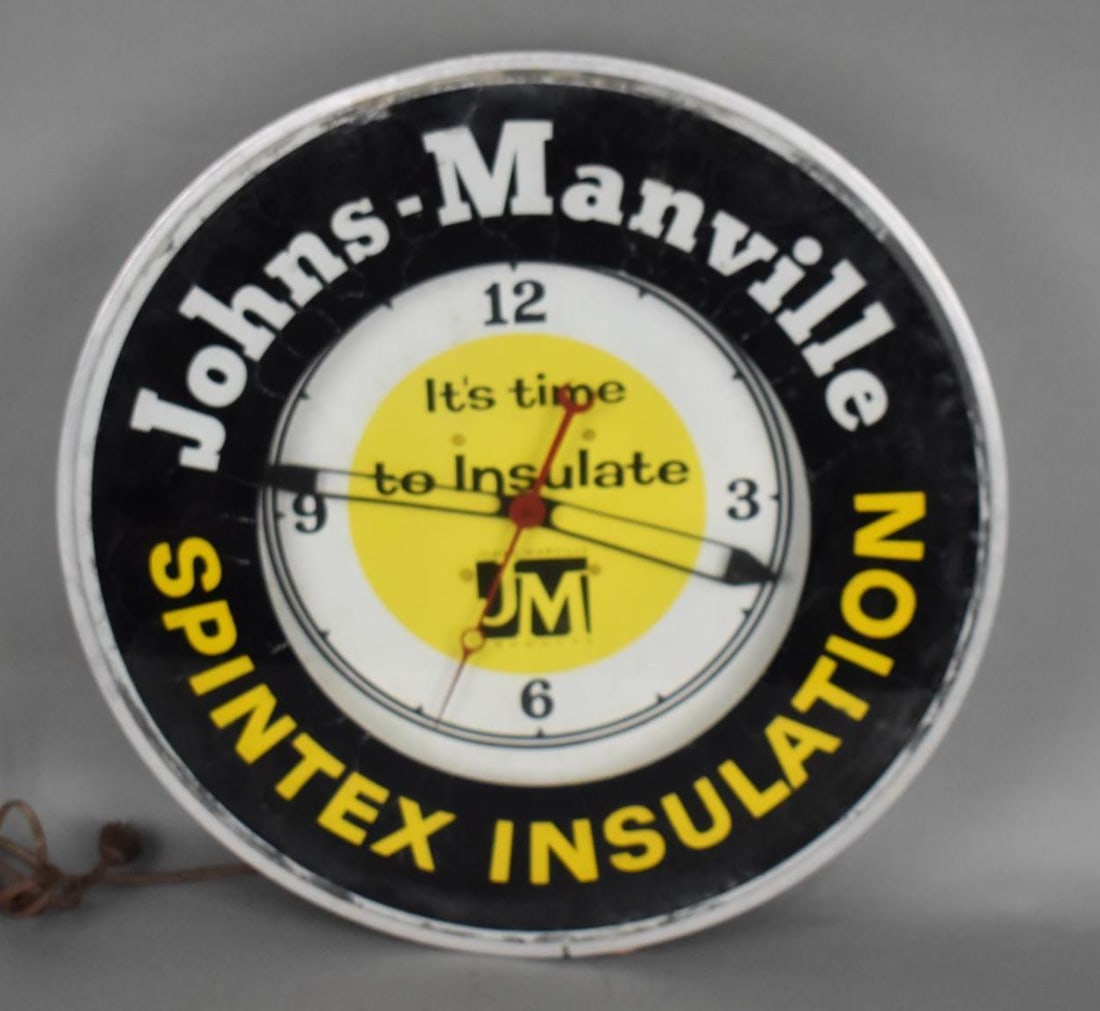 Johns-Manville Spintex Insulation Lighted Clock: rated 6.75, 19"x19"x4", the clock face is in good condition, the bezel has paint crazing, lights up and clock works.