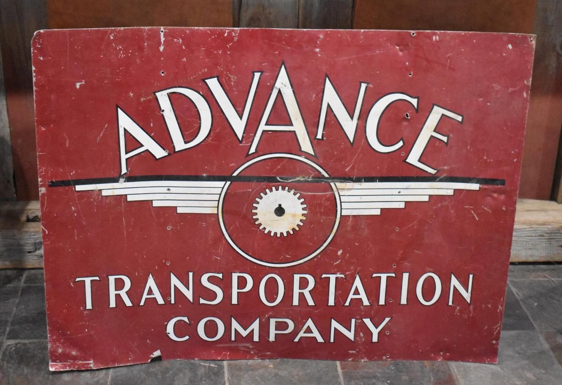 Advance Transport Co. w/Logo Metal Sign: rated 6.75, 36"x48", the SST sign has wear, extra holes and scratches, is off of a Semi-Trailer.
