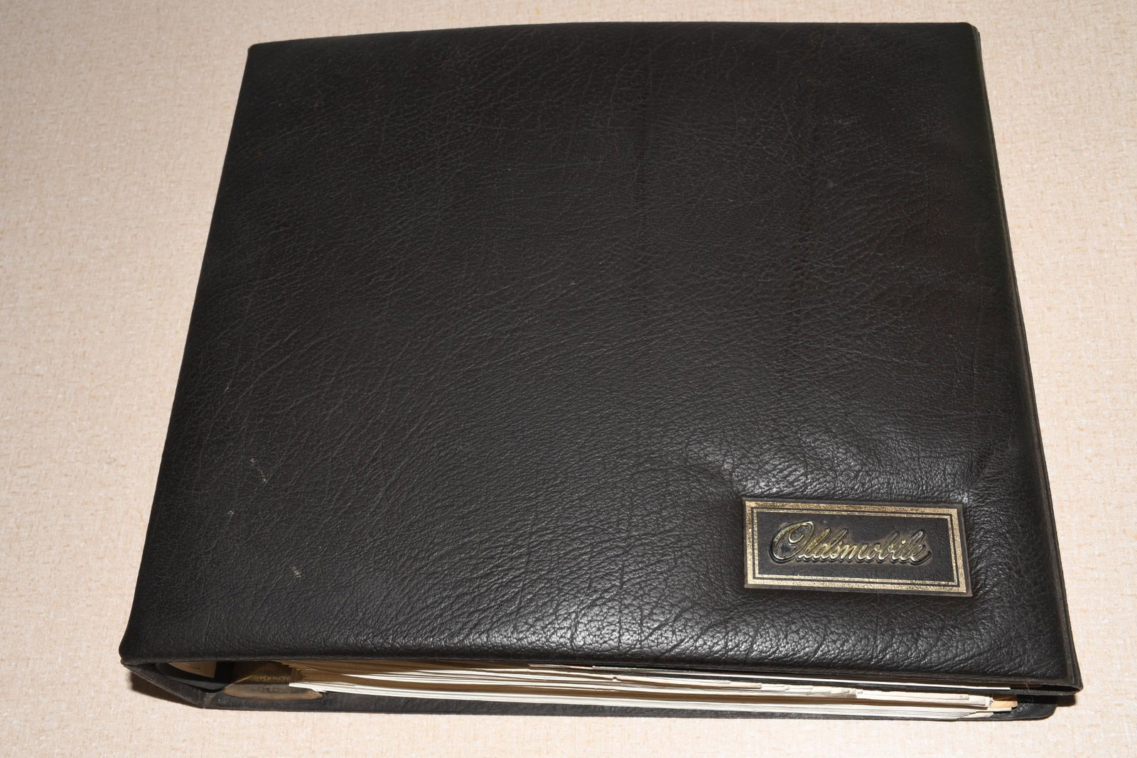 1975 Oldsmobile Dealer Album Paint Chips Upholstery Cutlass Toronado: 12"x13", the seven ring binder has light wear, has minor wear inside.