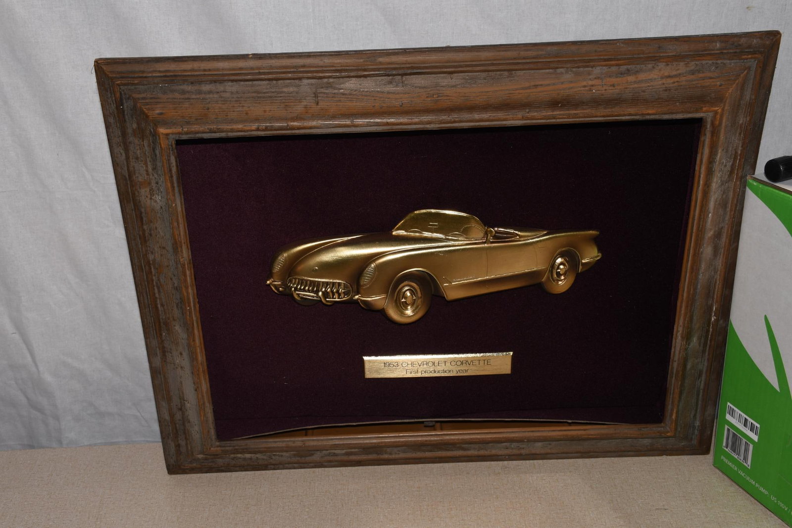 1953 Corvette GM Dealer Showroom Shadow Box: 18.5"x23.5", has soiling and damage to the lower shadow box, glass is missing.