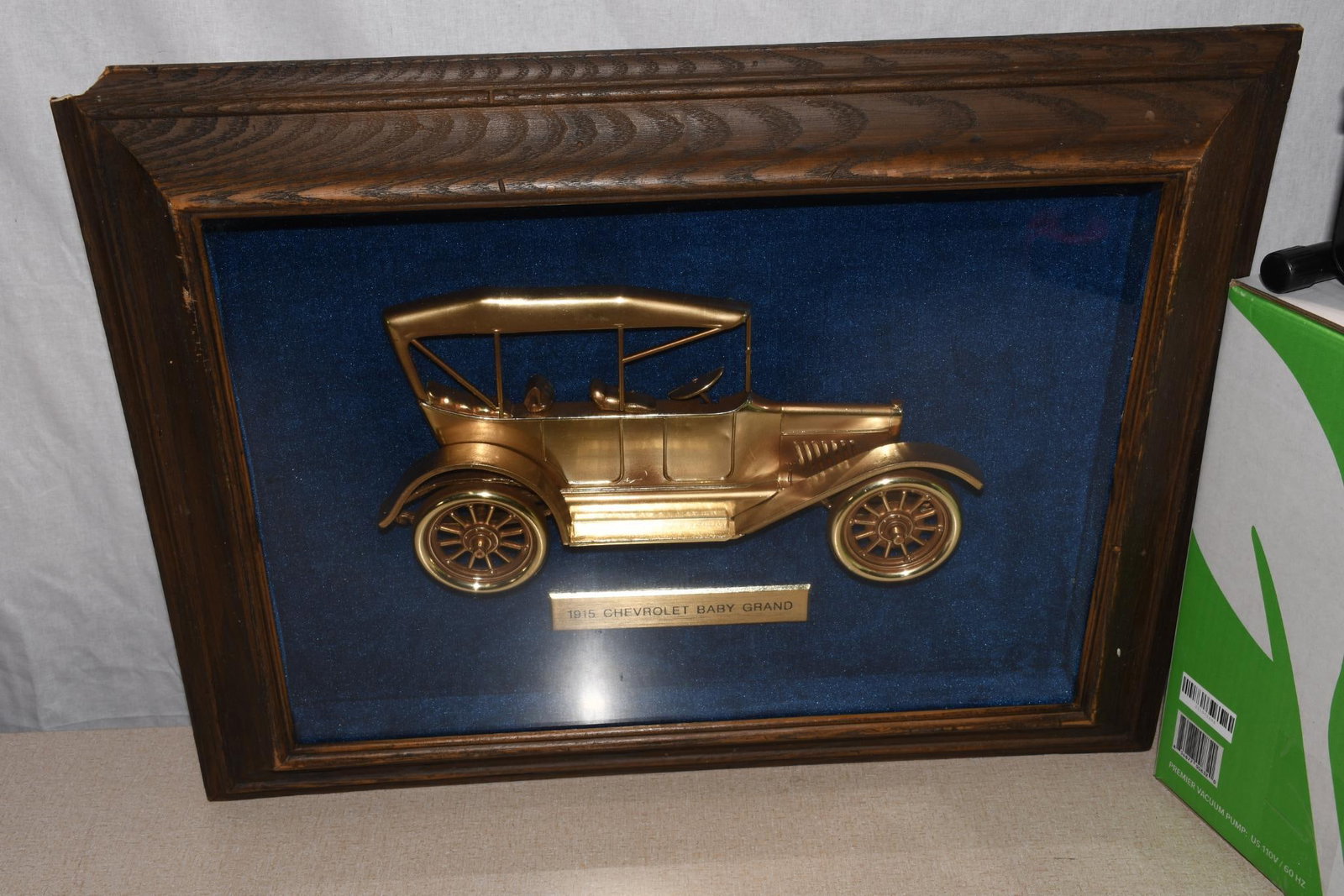 1915 Chevrolet Band Grand GM Dealer Showroom Shadow Box: 18.5"x23.5", in good condition, has minor damage at the upper left-hand corner.
