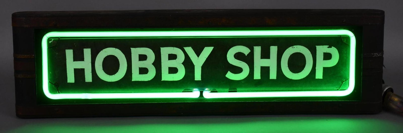 Hobby Shop Neon Sign: rated 8, 8"x26"x8", the neon sign lights up nicely, metal can has wear and rust.
