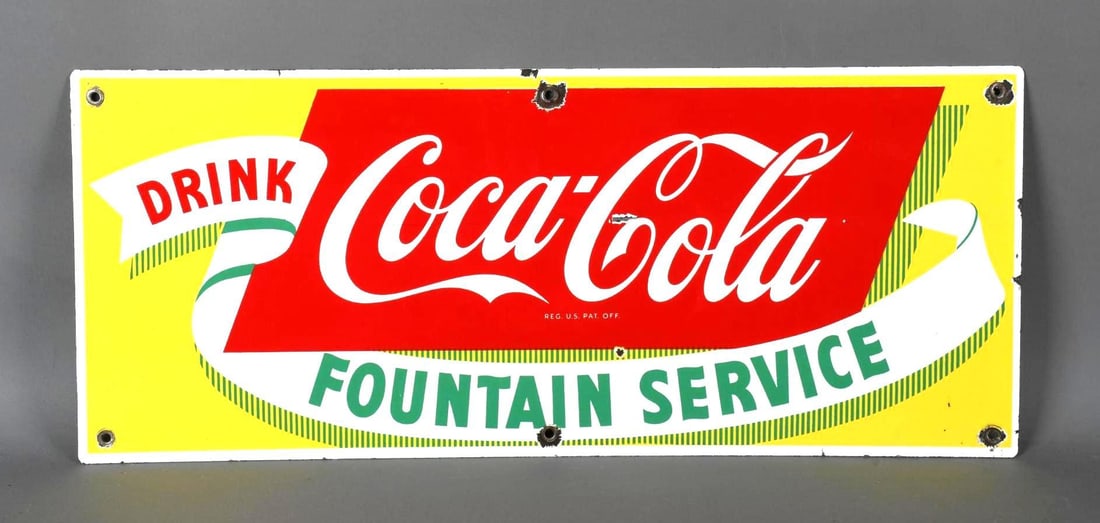 Drink Coca-Cola Sign of Good Taste Porcelain Sign (TAC): rated 8.25, 11.75"x28". the SSP sign has very good color and gloss, has small chips in the field and at the mounting holes. TAC #046053