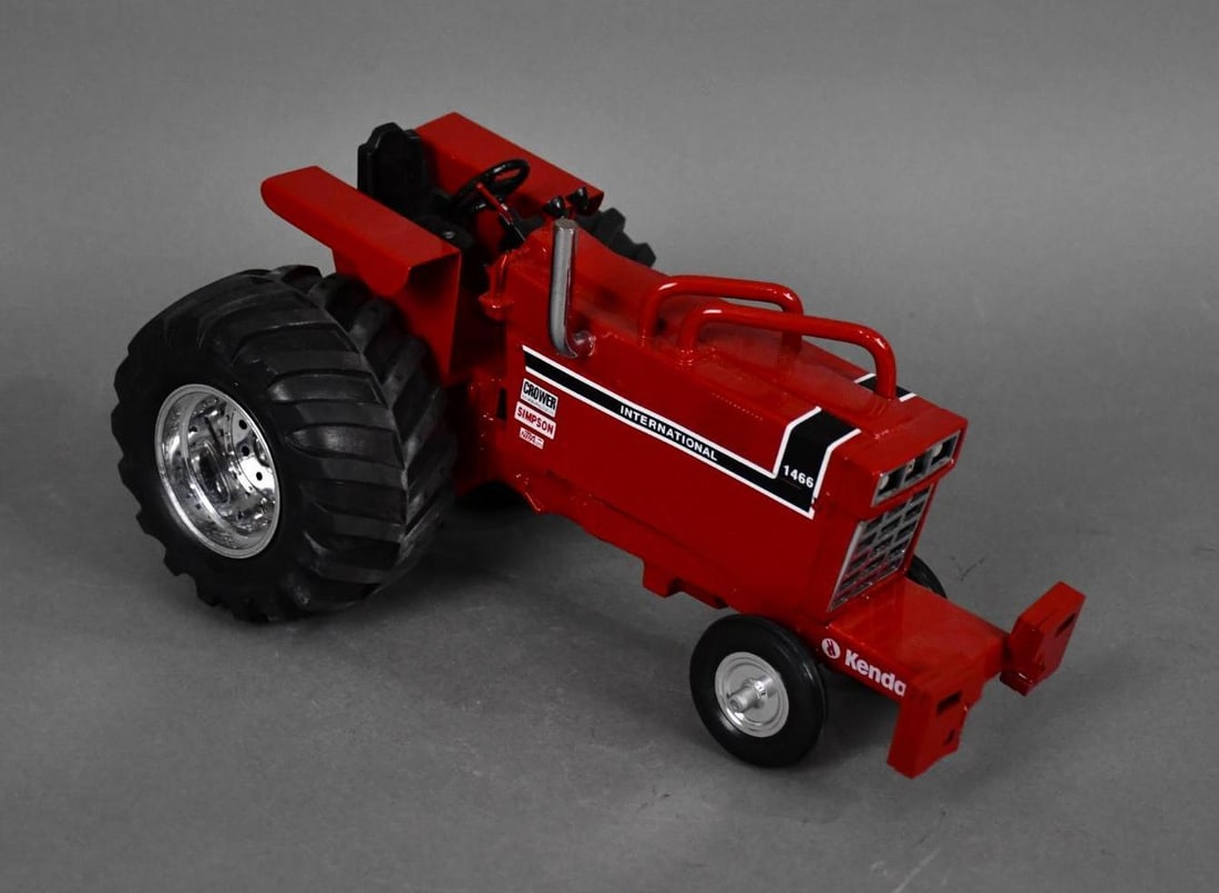 Custom International 1466 Black Stripe Pulling Tractor: 1/16, front weights, turbo cross, chrome rims, big rubber, strong detail and nice additions with all the guages and details up on the dash, very nice toy
