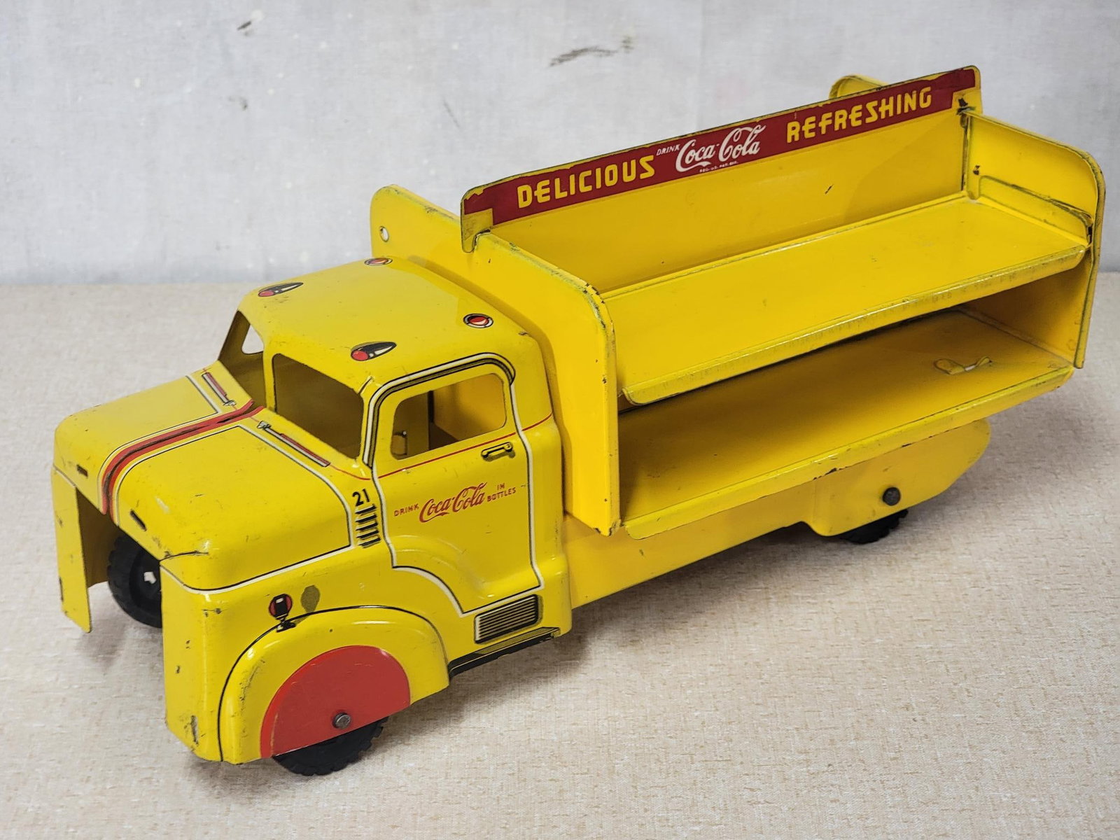 Marx Coca-Cola Delivery Truck: rated 7.5, 12.5"L, the press steel truck has good color and shine, is missing it's grill.