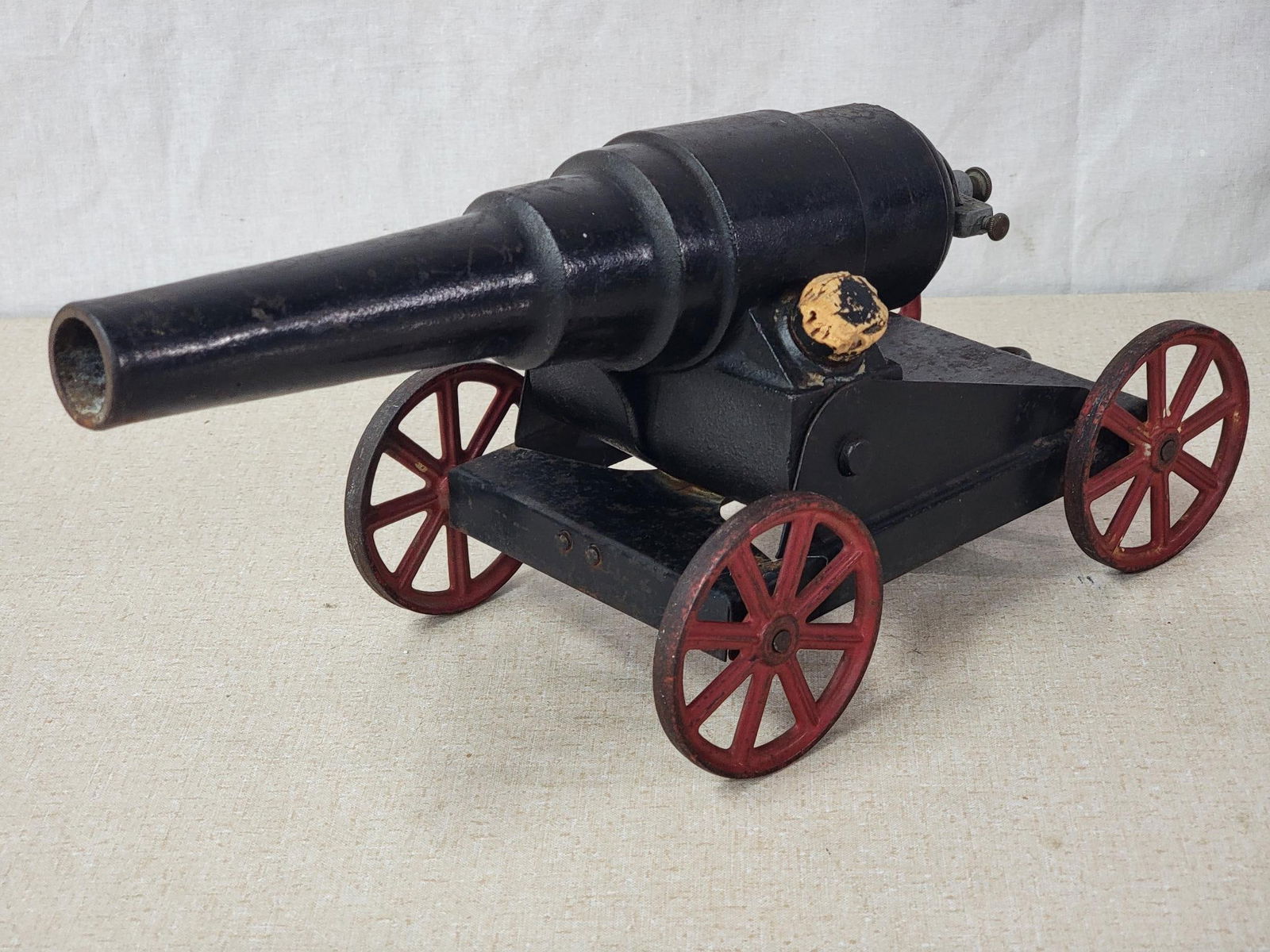 Cast Iron Carbide Cannon: rated 8, 14"L, the cast iron cannon has no breaks or repairs, has wear.