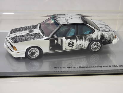 BMW 635 CSI Robert Rauschenberg Art Car Collection NIB: rated 9.5, 1/18 scale, toy is new in the plastic show case with, art book, box has minor tear at on flap.