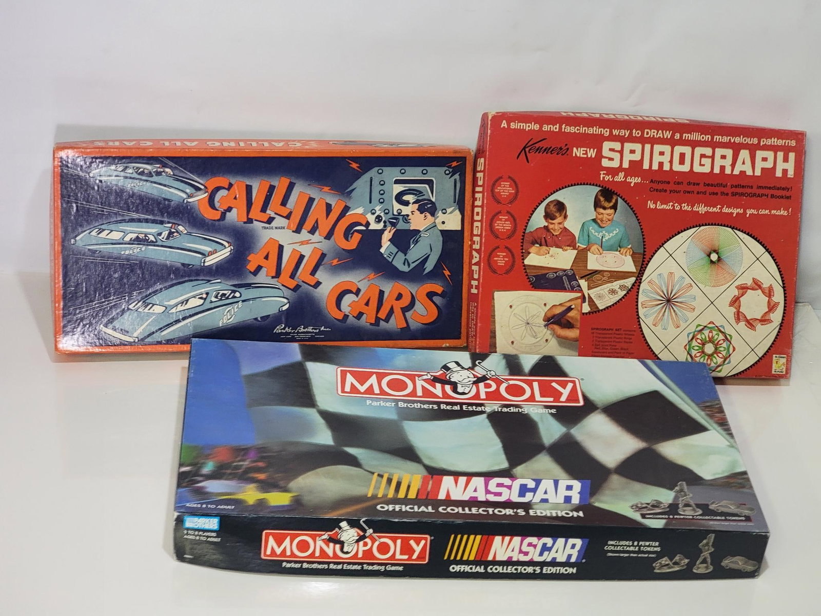 Calling All Cars Board Game by Parker Bros and more: rated 8.9, in very good condition, looks complete, comes with Nascar Monopoly & Spirograph.