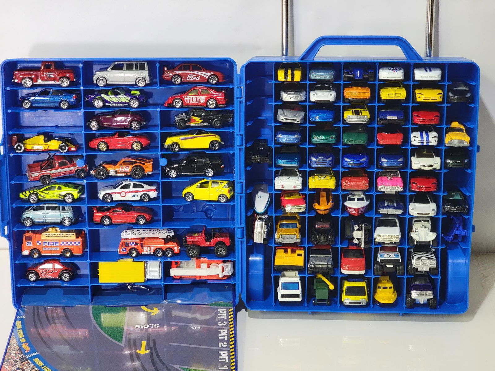 75-Matchbox Vehicles in Hard Case Carrier: rated 8 to 9, comes with a Hot Wheels hard case carrier with wheels and handle.