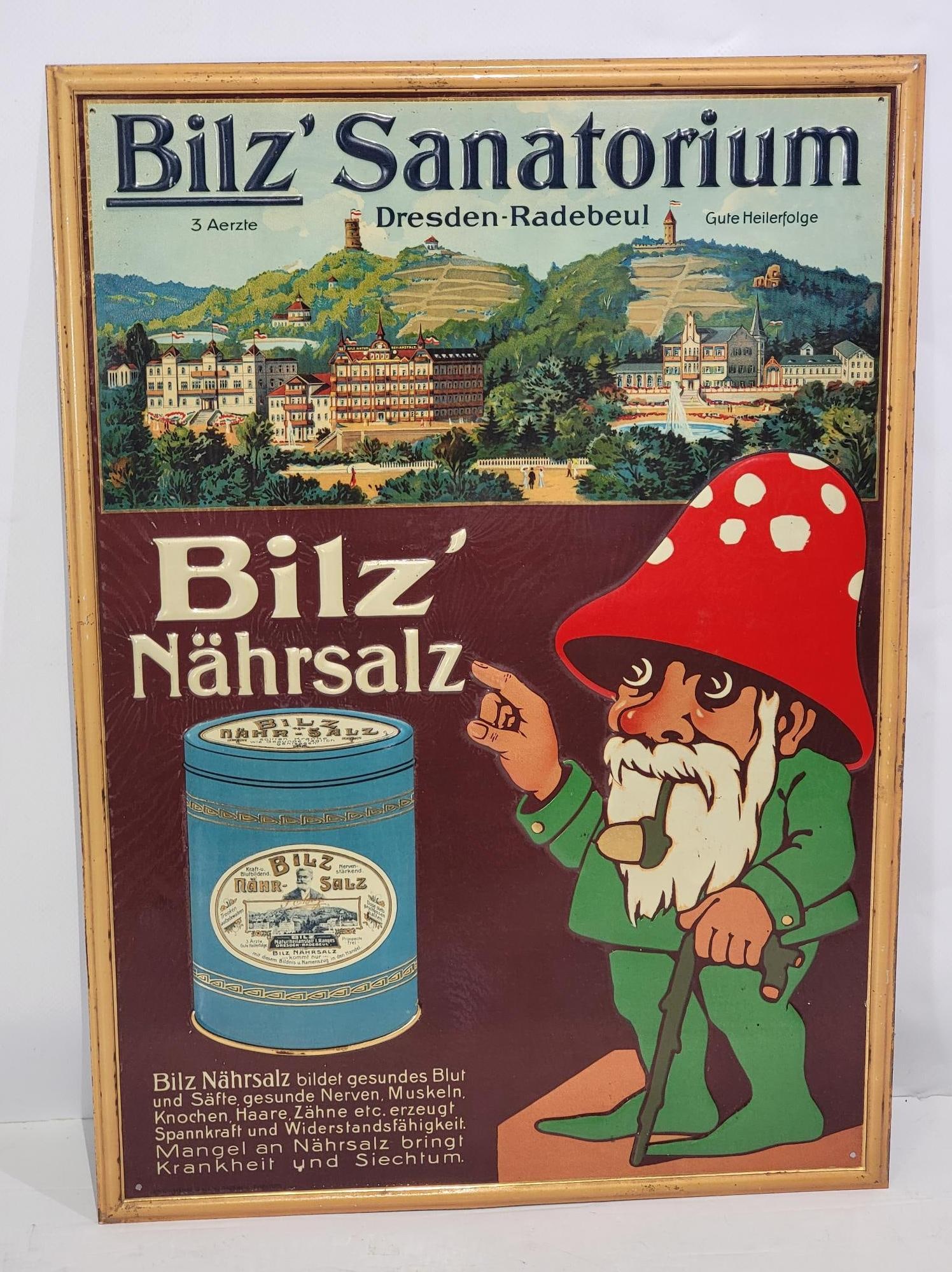 Bilz Sanatorium w/Image Metal Sign (TAC): rated 8.9, 20"x14.5", the SST embossed sign has good color and shine, has light paper marks. TAC #058296