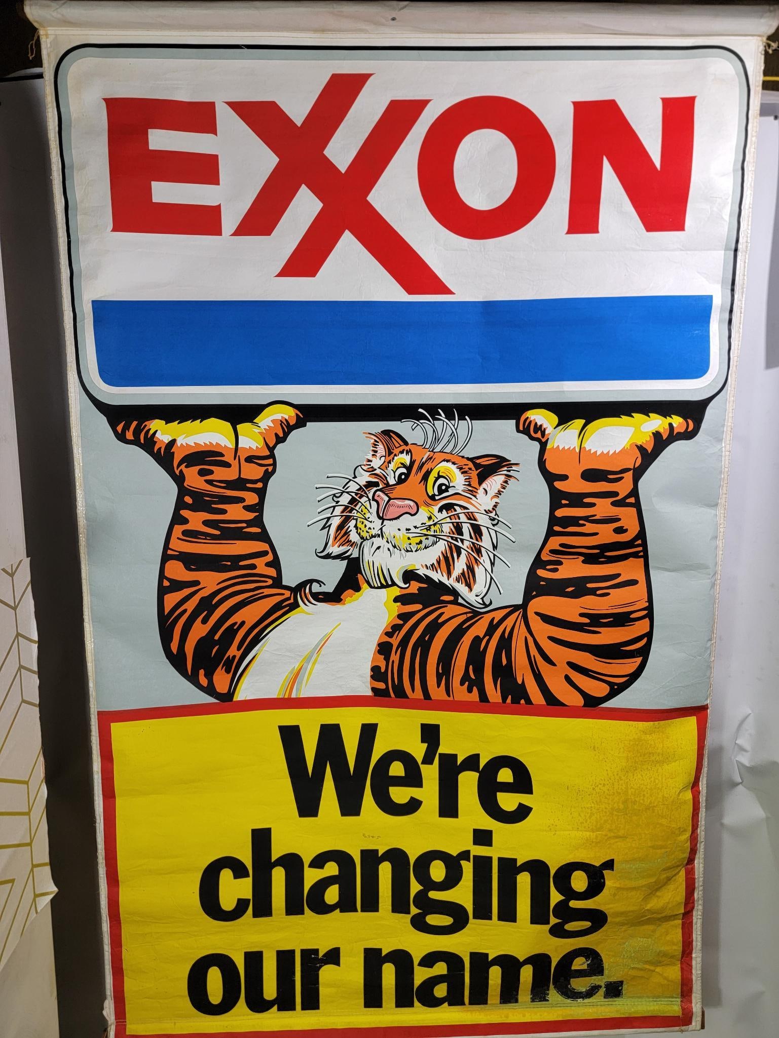 Exxon "We're Changing Our Name" Banner: rated 8.25, 88"x42", the banner has good color, field is clean, has soiling and wear in the lower right-hand corner.