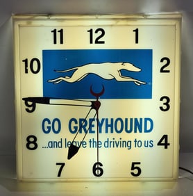 Go Greyhound "and leave the driving to us" w/Logo Lighted Plastic Clock