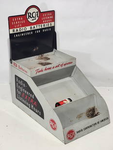 RCA Radio Batteries Metal Counter-Top Display Point of Sale: rated 8.5, 16"x9"x19", the metal display has good color and shine, has light wear, has more wear on the shelves, comes with two batteries.