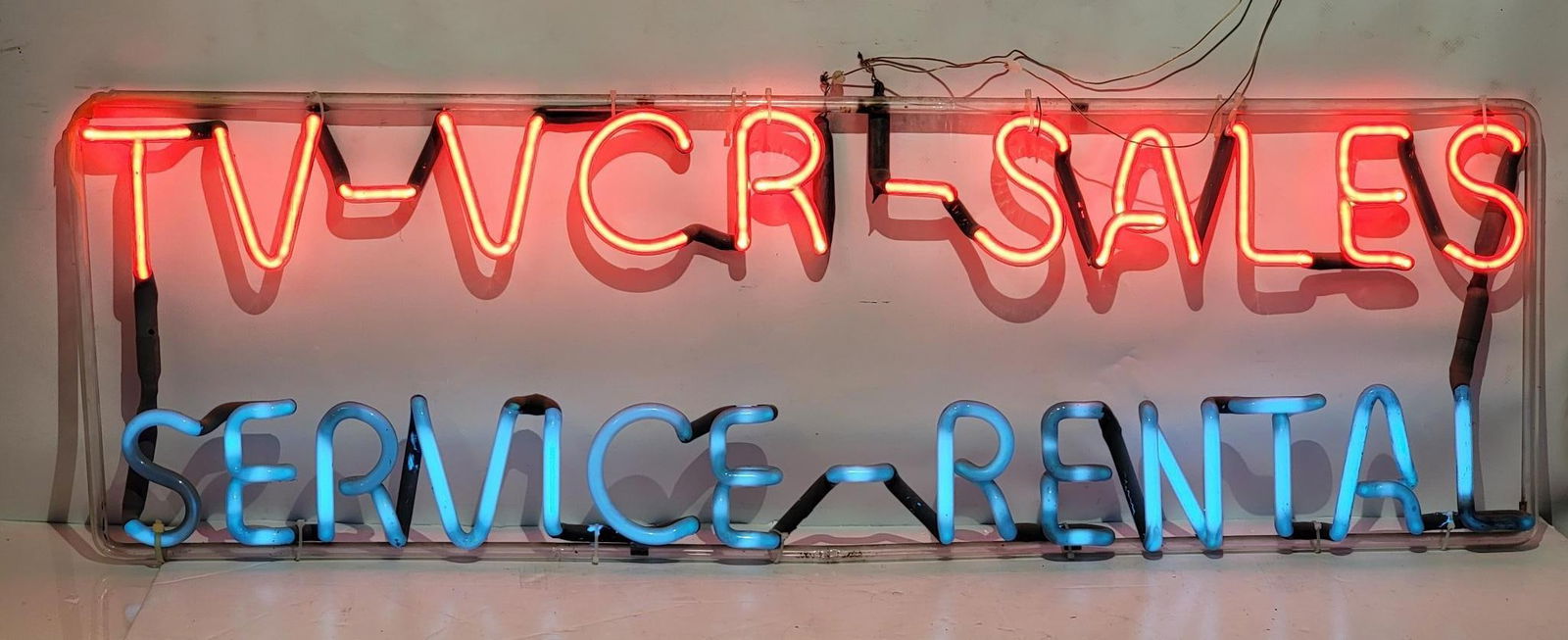 TV VCR Sales Service Rental Window Skelton Sign: rated 9, 14"x40", the window skelton sign is in good condition, works. This lot should be pickup or delivered to a show, if we ship this item we will not guarantee the neon from breakage.