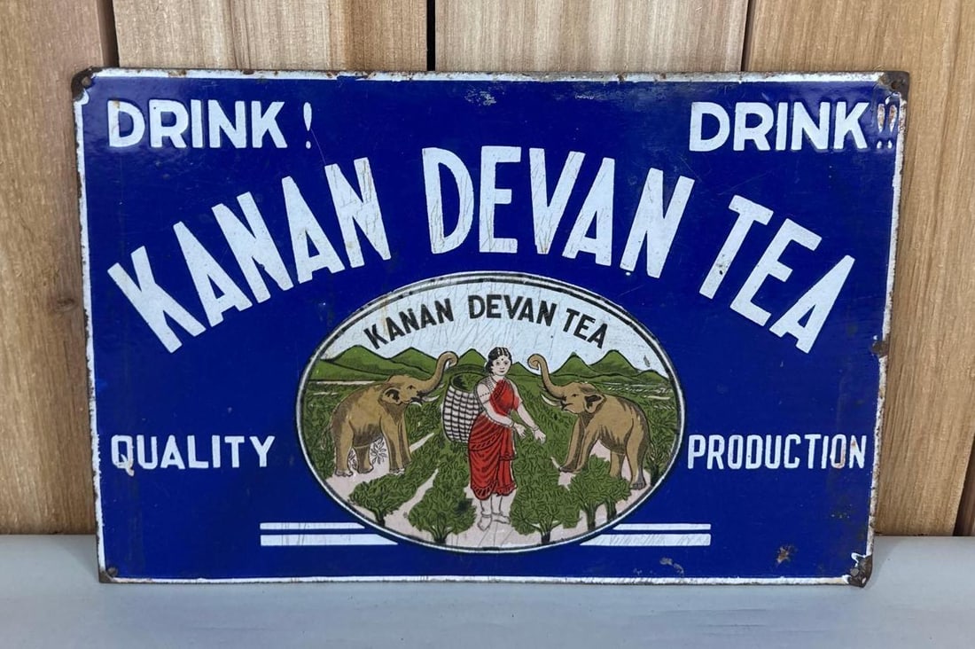 Drink Kanan Devan Tea w/Image Porcelain Sign: rated 8, 10"x15", the SSP sign has good color, has crazing in the field, chips around the perimeter.