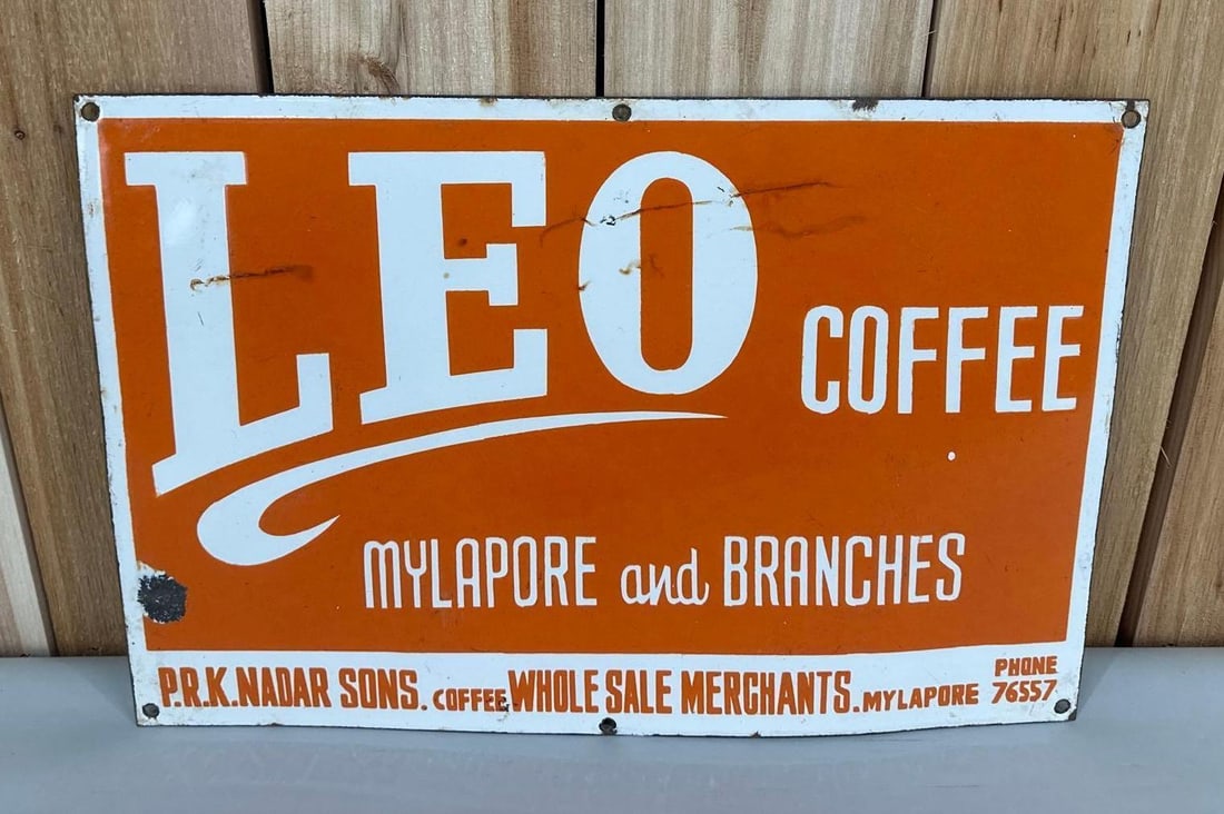 Leo Coffee Porcelain Sign: rated 8.25, 12"x18", the SSP sign has good color and gloss, has wear in the field, chips around the perimeter.
