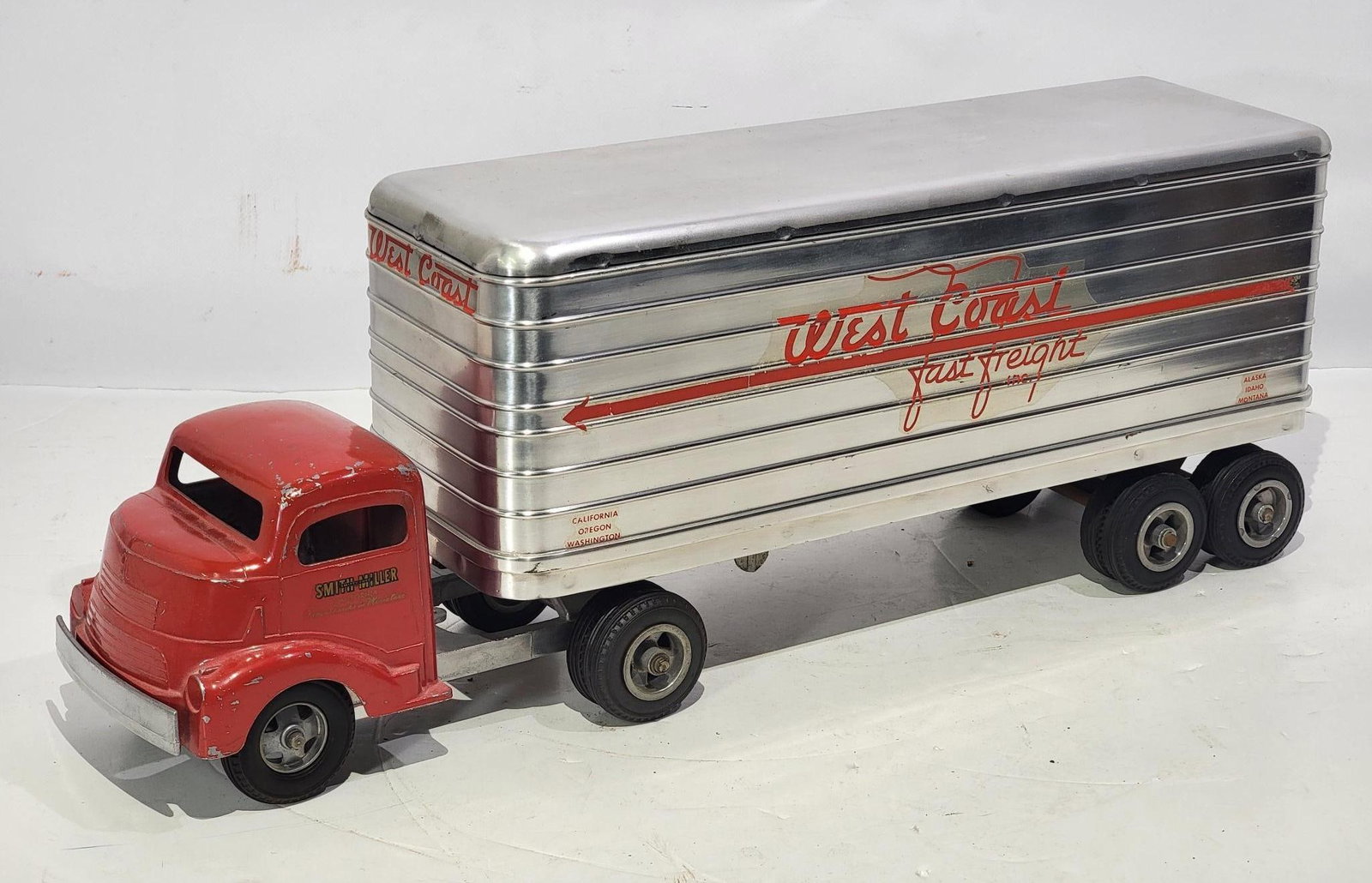 Smith Miller GMC Semi & West Coast Fast Freight Trailer: rated 8, 24"L., the Semi has light wear and paint chips, trailer is in very good condition.