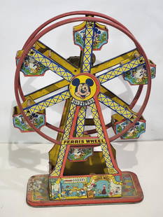 Chein Disneyland Ferris Wheel Tin Litho Windup Toy: rated 6.5, 17"T., the Ferris Wheels has dust staining, motor is weak.