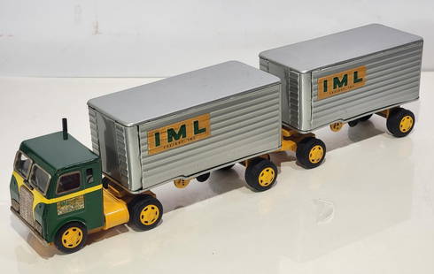 IML Semi w/Two Trailers Japanese Tin Litho Friction Truck: rated 9, 21"L., the metal friction semi and trailers have good color and shine, Semi window frames have light rust.