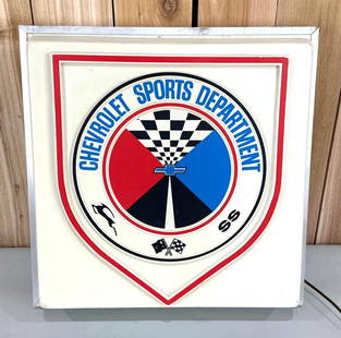 Chevrolet Sports Department w/Logo Plastic Lighted Sign (TAC): rated 8.5, 20"x20"x6", the molded plastic panel has good color, has a one inch hairline crack at the upper right-hand corner, mounted on metal light box.&nbsp; TAC #032244