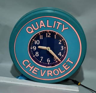 Original Neon Clock w/New Chevrolet Bezel: rated 8.5, 32"D., the neon clock lights up and works.