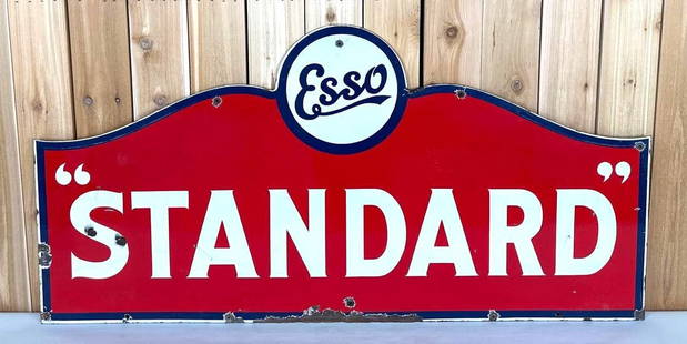 Rare Esso "Standard" Porcelain Sign (TAC): rated 8.25, 29.5"x59.5", the DSP diecut sign has good color and gloss, has light wear and tiny chips in the fields, has extra nail holes around the perimeter, has large chip area along the bottom edge