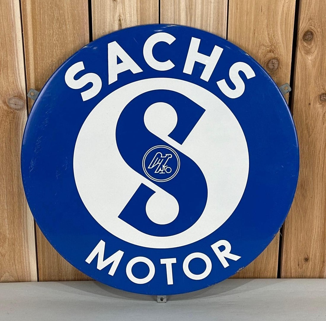 Sachs Motor w/Logo Porcelain Sign (TAC): rated 9, 23.5"D. the SSP rolled edge sign has very good color and gloss, has light wear in the outer field and tiny chips around the perimeter. TAC #059142