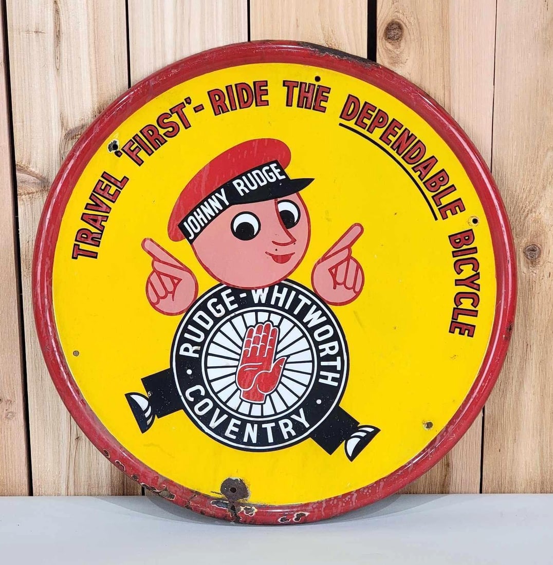 Rudge-Whitworth Coventry w/Johnny Rudge Logo Porcelain Sign (TAC): rated 8.25, 23"D., the SSP embossed edge sign has good color and gloss, has staining in the field, chips around the perimeter. TAC #059006
