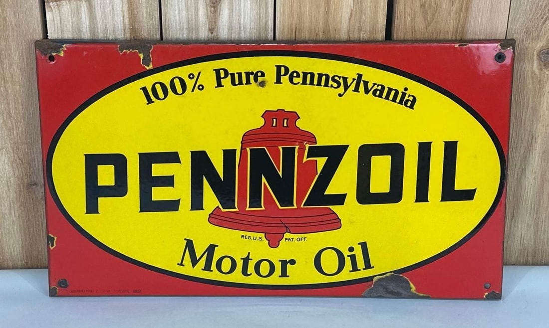 Pennzoil Motor Oil w/Red Bell Logo Porcelain Sign (TAC): rated 8.5, 14"x23.5", the SSP rolled edge sign has good color and gloss, has small chip and wear in the field, more chips around the perimeter, marked. TAC #059011