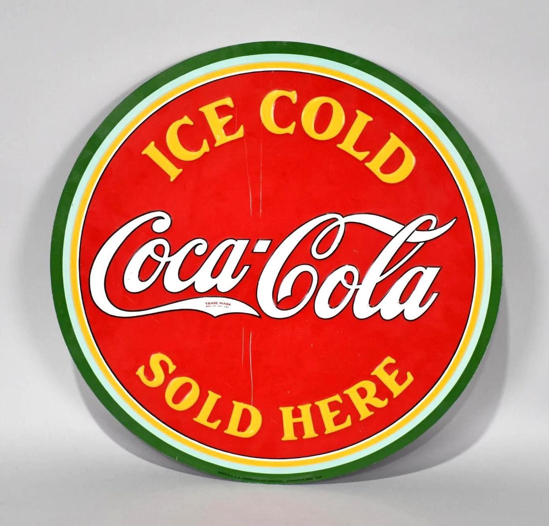 Coca-Cola Ice Cold Sold Here Metal Sign (TAC): rated 8.25, 19.75"D., the SST embossed sign has good color and shine, has a couple of scratches in the field, marked American Art Works, dated 1933. TAC #040020