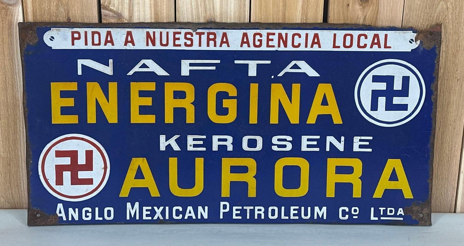 NAFTA Energina Kerosene Aurora w/Indian Good Luck Symbol Porcelain Sign (TAC): rated 7.5, 16"x31.25", the SSP rolled edge sign has good color and some gloss, has wear in the field, has rust and metal loss around the perimeter. TAC #059068