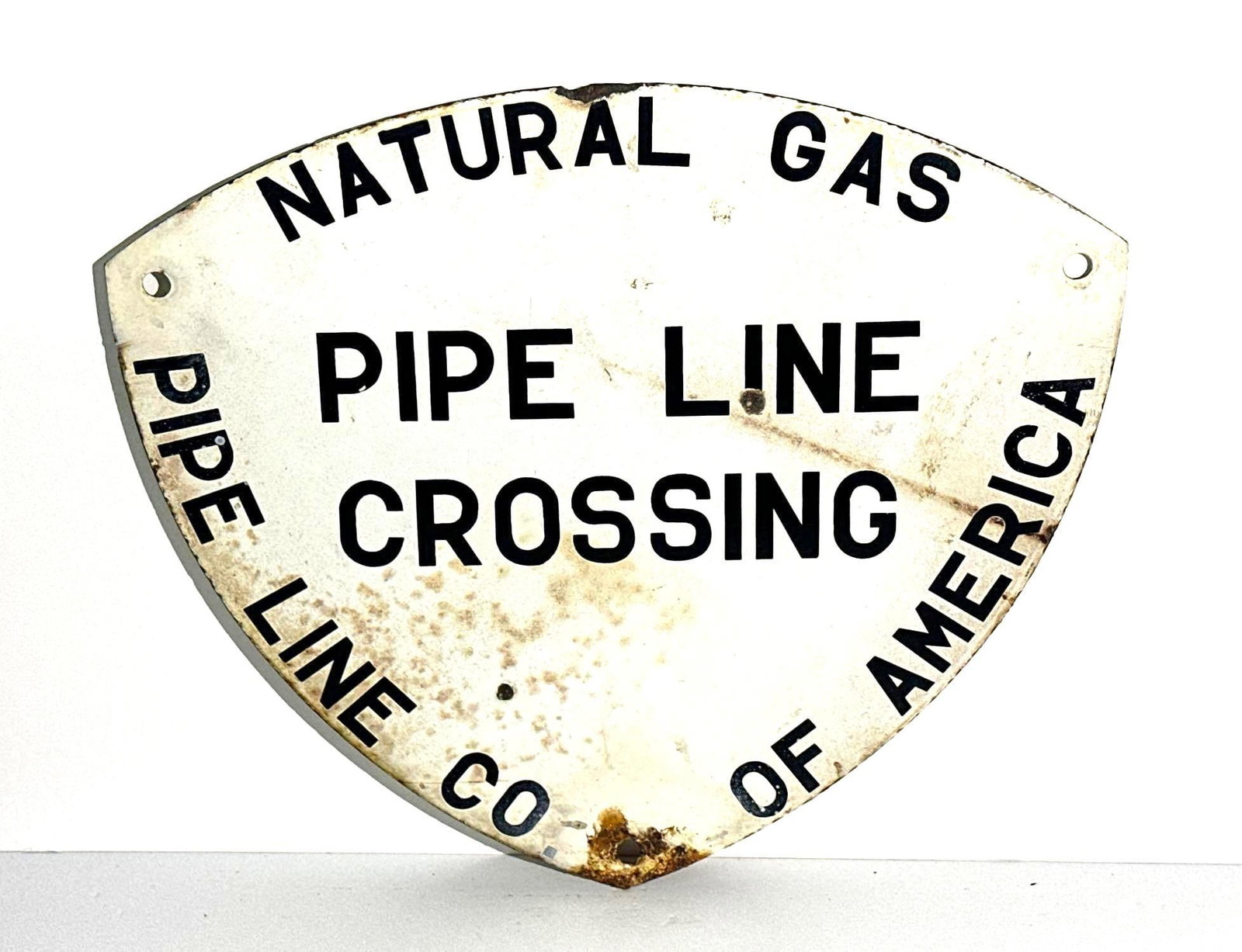 Pipe Line Co. Of America Metal Sign: rated 6.75, 14"x16", the SST diecut sign has rust staining, ceases and dings. This lot can be picked up in Tidioute, PA on September 18 - 22 or this lot can be taken back to our facility to be