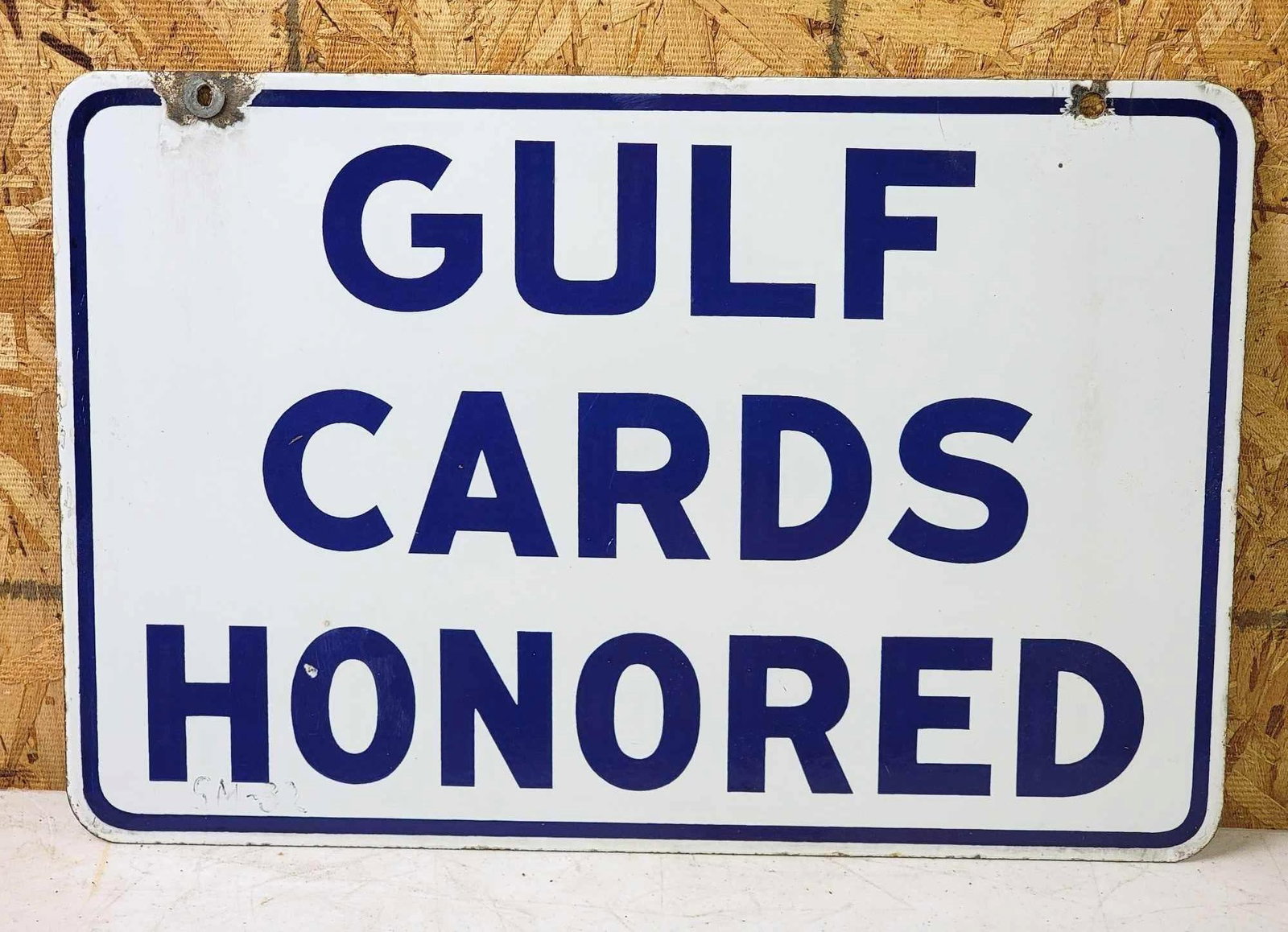 Gulf Cards Honored Porcelain Sign: rated 8.9, 12"x18", the DSP sign has excellent color and gloss, tiny chips in the field and at the mounting holes. This lot can be picked up in Tidioute, PA on September 18 - 22 or this lot ca