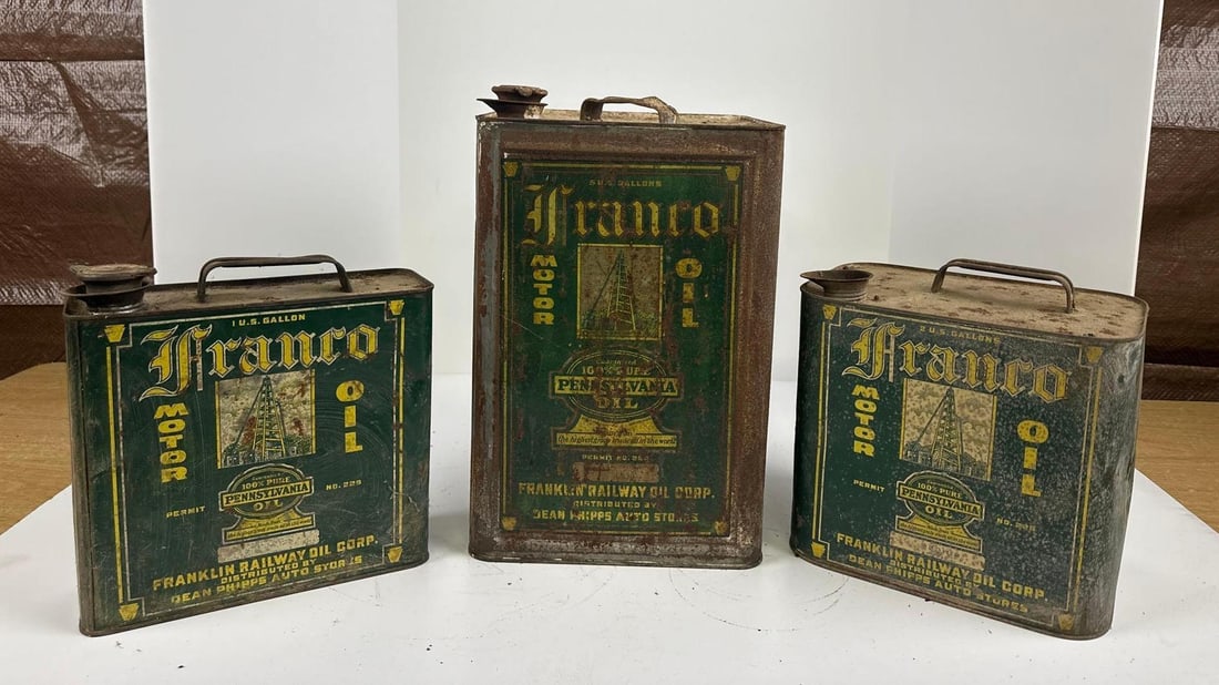 3-Different Franco Motor Oil Cans: rated 5 to 6, all have wear and scratches, all are empty, five gallon square, two-gallon rectangle & One gallon flat. This lot can be picked up in Tidioute, PA on September 18 - 22 or this lot can
