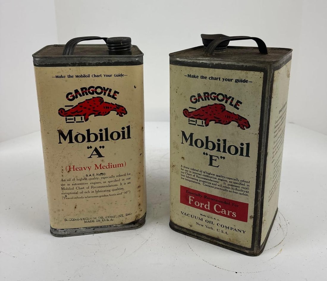 2-Mobiloil Motor Oil "E" & "A" One Gallon Square Metal Cans: rated 8, both are empty, both have light wear, the Ford has minor staining on back. This lot can be picked up in Tidioute, PA on September 18 - 22 or this lot can be taken back to our facility to be s