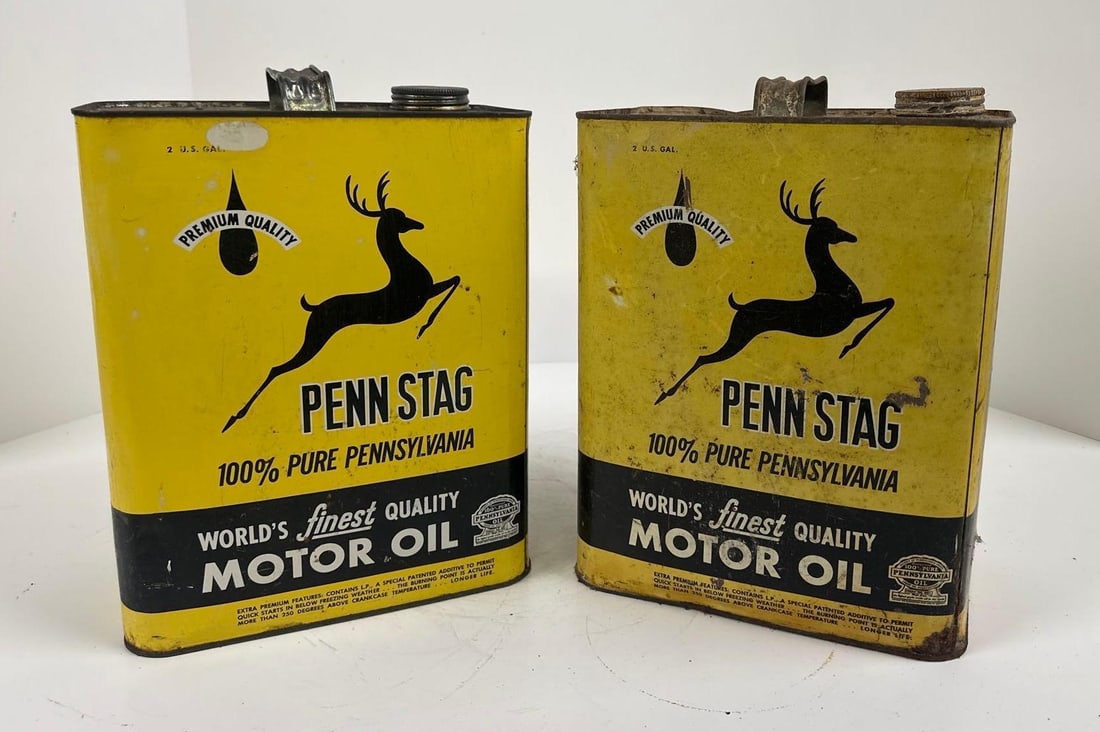 2-Penn Stag Motor Oil Two-Gallon Rectangle Metal Cans: rated 7 & 8, both are empty, one has more wear and soiling than the other. This lot can be picked up in Tidioute, PA on September 18 - 22 or this lot can be taken back to our facility to be shippe