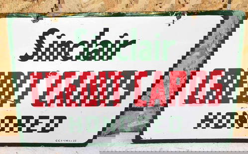Sinclair Credit Card Honored Porcelain Sign: rated 7, 14&#34;x23&#34;, the DSP sign has good color and gloss, has chips and ceases in the field. This lot can be picked up in Tidioute, PA on September 18 - 22 or this lot can be taken back to our