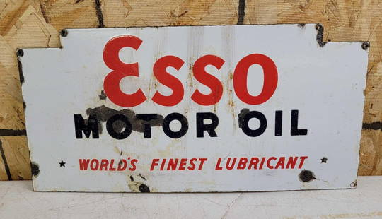 ESSO Motor Oil Porcelain Sign: rated 5.5, 10.5&#34;x22&#34;, the SSP sign is for a oil bottle rack, has chips and crazing. This lot can be picked up in Tidioute, PA on September 18 - 22 or this lot can be taken back to our facility