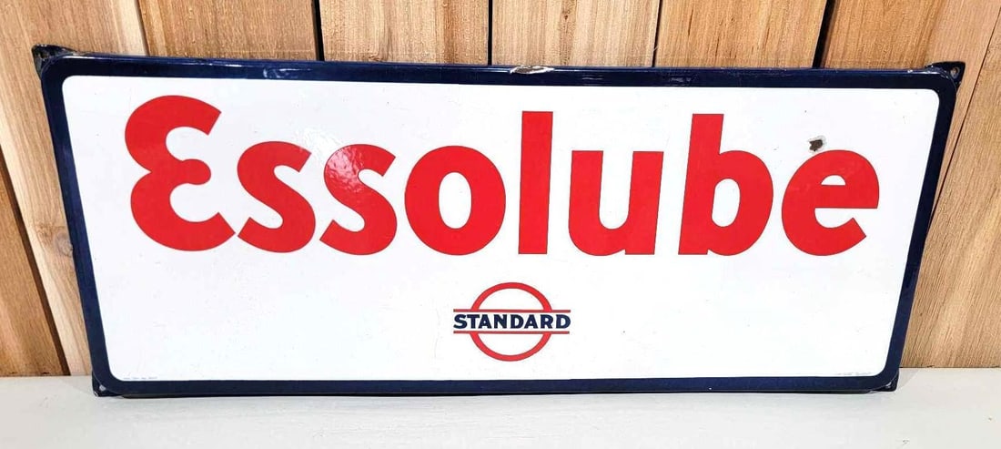 Essolube w/Standard Bar & Circle Logo Porcelain Sign (TAC): rated 8.9, 12"x30.5", the SSP rolled edge sign has excellent color and gloss, has one chip in the right-hand field, marked Langcat. Rarity 6. TAC #060008