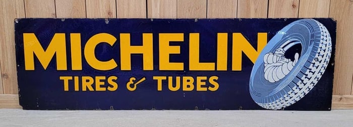 Michelin w/Bibendum Seating in a Tire Porcelain Sign (TAC)