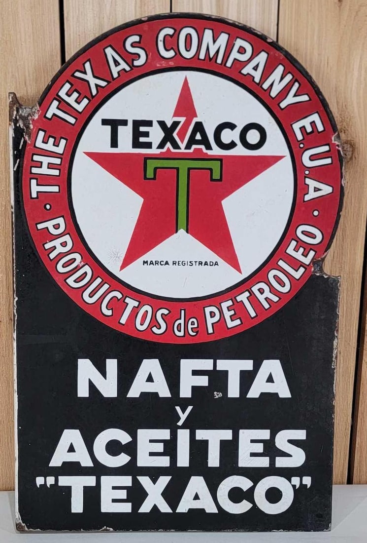Texaco (black-T) NAFTA Porcelain Flange Sign (TAC): rated 7.5, 27.5"x17.5", the diecut porcelain flange sign has good color, not much gloss, a few small chips in the fields and around the perimeter. Rarity 8. TAC #060256