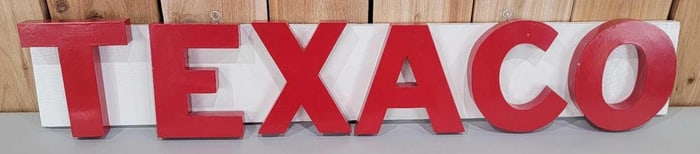 Plastic TEXACO Letters Mounted on wood.