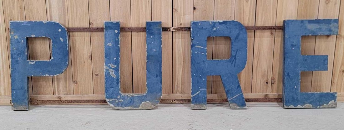 PURE Cast Aluminum Letters: rated 7.5, 24"T., the cast aluminum letters are in good condition, has is chipping off, mounted on metal rails.