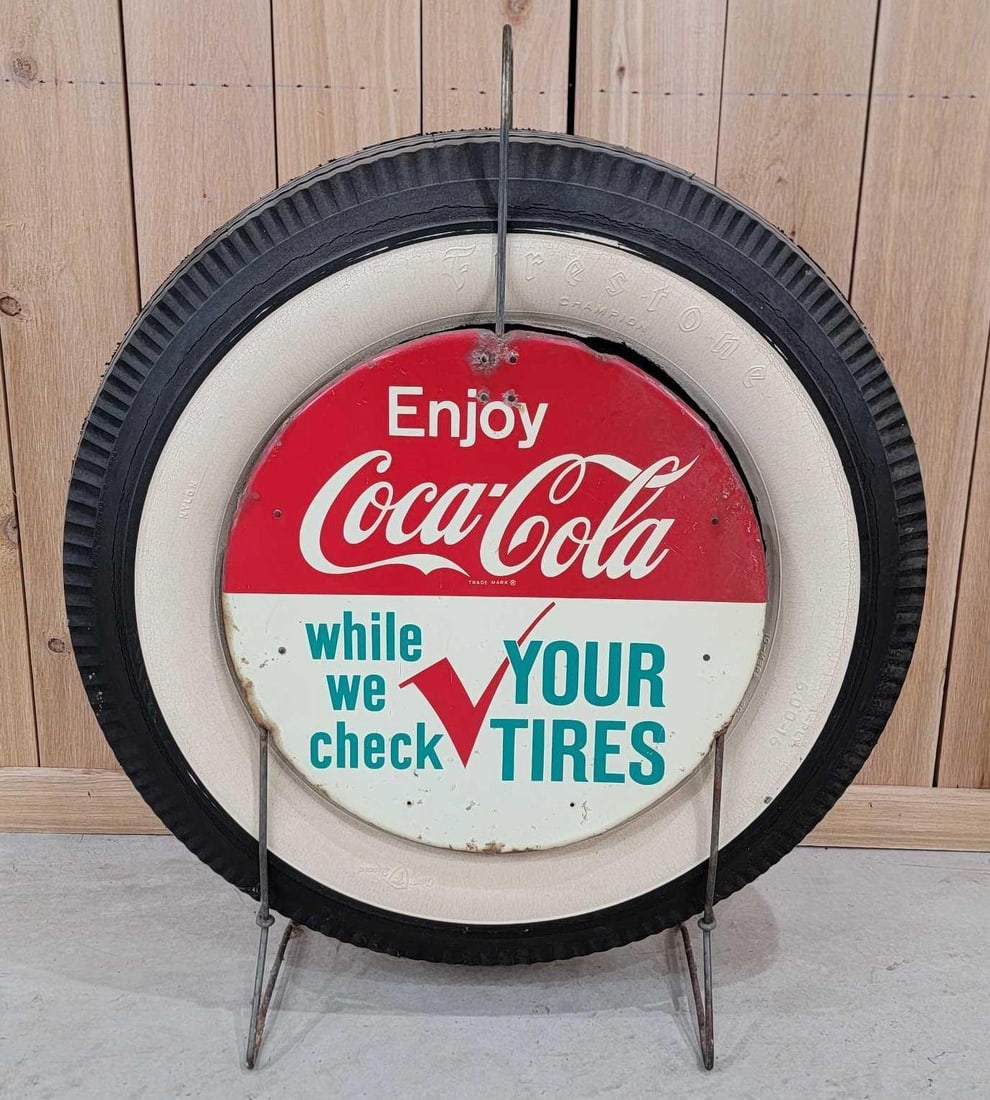 Enjoy Coca-Cola "while we check your tires" Metal Tire Holder (TAC): rated 7.5, 16.5"D., the 2-SST sign have good color, both have wear and paint spots, has a Firestone in it. Rarity 2. TAC #060340